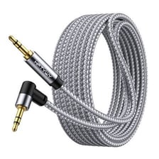 An auxiliary audio cable plugged into a car stereo