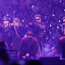 BTS performing together on a concert stage