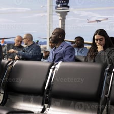 A traveler waiting in an airport during a layover.