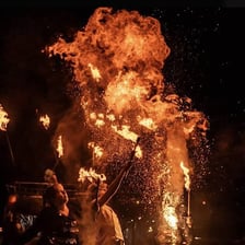 Bright flames alongside a celebratory athletic performance
