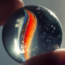 A round glass marble shown in close-up.