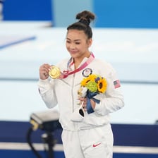 Sunisa Lee competing as an Olympic gymnast.