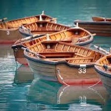 Rowboats equipped with oars on a lake