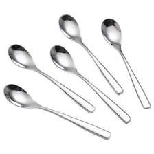 A spoon holding a small amount of cream.