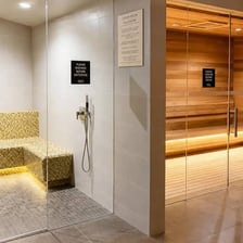 A spa interior with a sauna and steam room
