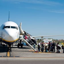 Passengers getting onto an airplane.