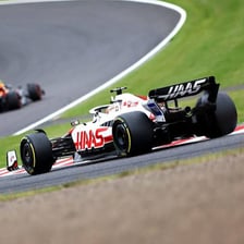 Open-wheel race cars competing in a Grand Prix