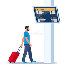 A traveler hurrying toward an airport departure gate