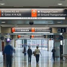 A Philadelphia International Airport terminal sign displaying the PHL code