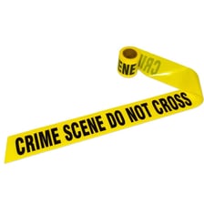 A house shown with police tape after a reported burglary.