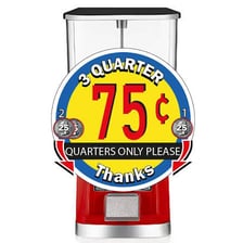 A gumball machine with an instruction marking where to insert a coin