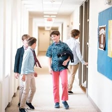 Middle school students in a school hallway