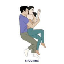 A couple cuddling with one person positioned behind the other.