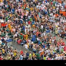 A large disorderly crowd gathered in a public place