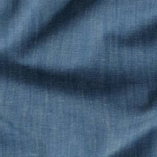 Close-up view of the woven texture of blue denim