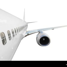 A passenger airplane showing wings extending from the fuselage.