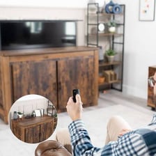 Televisions and their remote controls in a household living room