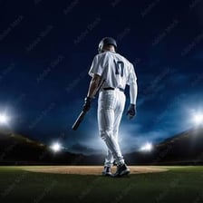 A baseball batter standing at home plate with a bat.