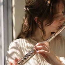 A musician performing a soft, melodic passage