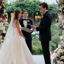A bride and groom exchanging vows at a wedding altar.
