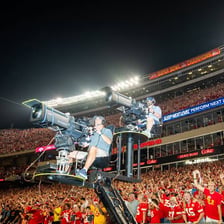 An American football game being played in a stadium on Sunday.