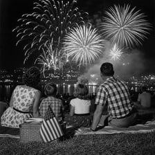 Spectators watching a colorful fireworks display