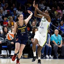 Caitlin Clark playing in a WNBA basketball game
