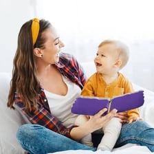 An adult speaking in an exaggeratedly gentle way to a baby