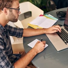 A person beginning work at a desk.