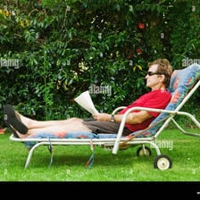 A person resting comfortably in a lounge chair