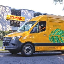 A DHL delivery vehicle used for shipping and logistics