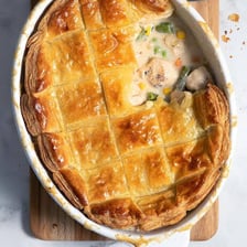 A baked pot pie with a browned, flaky crust.