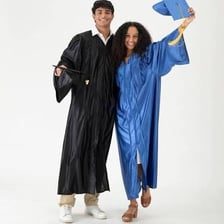 A college graduate wearing academic cap and gown.