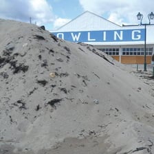 Several large piles of sand.