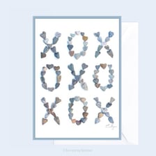 A greeting card bearing the handwritten sign-off XOXO.