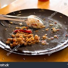 A diner eating the last of a meal.