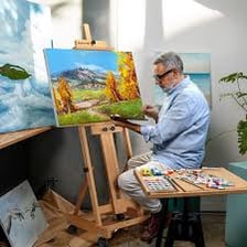 An easel supporting a canvas in a painter’s studio.