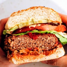Soybeans alongside a plant-based veggie burger