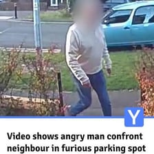 An angry person confronting another person in an aggressive stance.