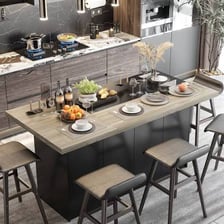 A freestanding island counter in the center of a kitchen.