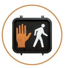 A pedestrian signal displaying a raised hand for “don’t walk.”