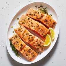 A salmon fillet served as food, a source of omega-3 fatty acids.