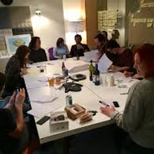 An actor holding and reading a film script.