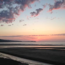 A sky transitioning from daylight into twilight
