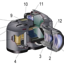 An SLR camera shown with its mirror-and-prism optical path.