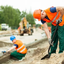 A worker performing physically demanding manual labor