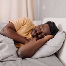 A person sleeping in bed.