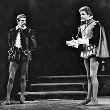 Actor in period costume delivering a dramatic Shakespearean exclamation