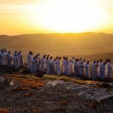People beginning a Jewish holiday observance around sunset.