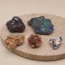 A collection of varied ore and mineral specimens.